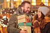 Adult couple shopping in the city during Christmas time: | © Kalim - stock.adobe.com