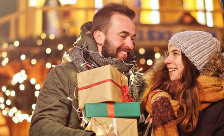 Adult couple shopping in the city during Christmas time: | © Kalim - stock.adobe.com