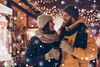 Having fun together at a christmas fairy with snowfall...: | © deagreez - stock.adobe.com